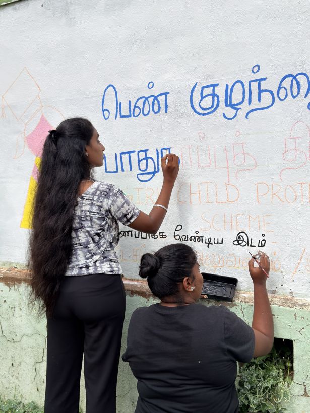 Wall painting by volunteers on Girl Child Protection Scheme